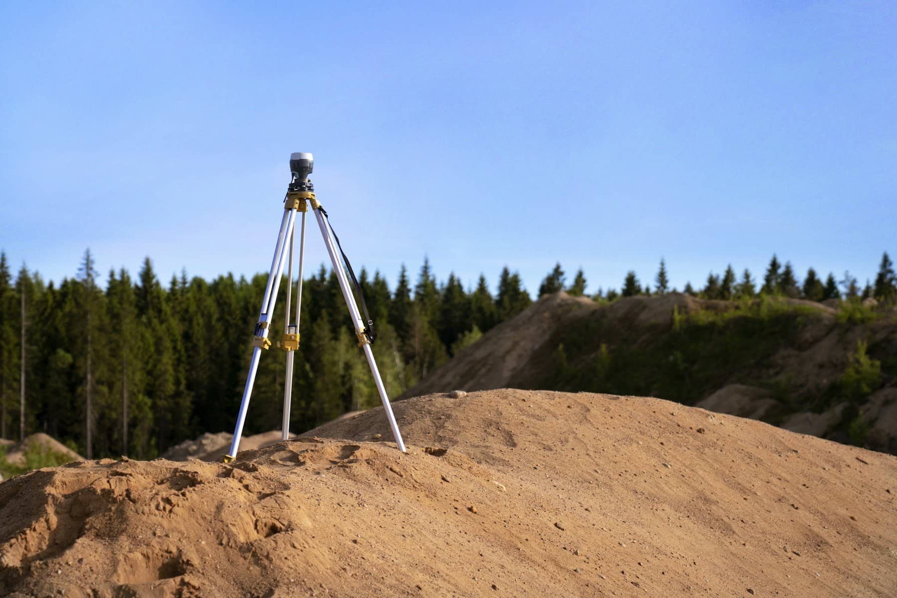 GNSS receiver set up on a high point of the land